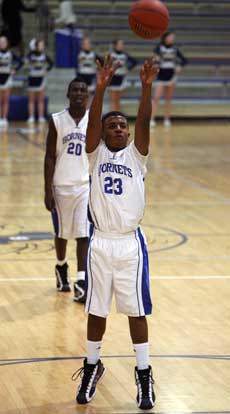 C.J. Rainey hit 5 of 6 free throws in overtime for the Hornets. (Photo by Rick Nation)