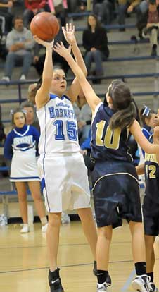 Rori Whittaker (15) shoots over Pulaski Academy's Bailey Byrne. (Photo by Kevin Nagle)