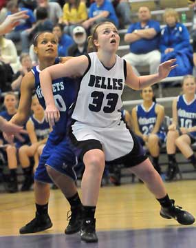 Bryant's Breanna Blundell, left, fights for rebounding position with Mount St. Mary's Mallory Kleine. (Photo by Kevin Nagle)