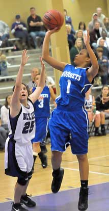 Kiara Moore (1) shoots over Mount St. Mary's Summer Khairi (25). (Photo by Kevin Nagle)