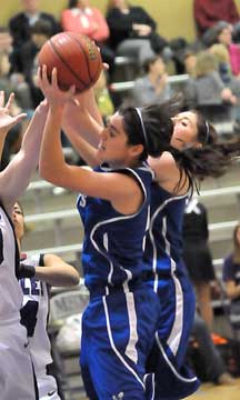 London Abernathy grabs a rebound. (Photo by Kevin Nagle)