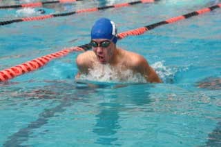 Jordan Combs takes a breath during the breast stroke.