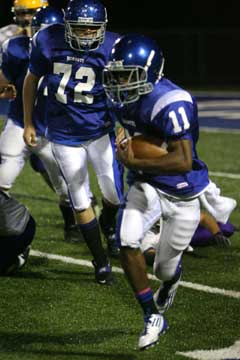 Mar'Kevius Nelson (11) breaks upfield off a block by Andrew McBride. (Photo by Rick Nation)