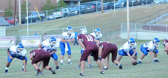 Bryant center Seth Hoffmans prepares to snap to quarterback Wesley Akers with Sawyer Ivey (53), Jacob Ward (50) and Dalton Griesemer (87) along with Benton linebacker Jay Lucas (18) prepare for the play. (Photo by Kevin Nagle)