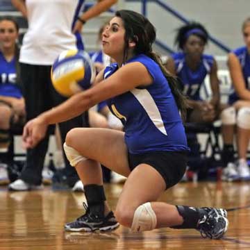 Bryant's Carley Choate gets down to receive a serve. (Photo by Rick Nation)