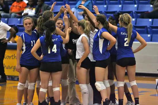 The Lady Hornets huddle around their coaches during Tuesday's match at North Little Rock. (Photo by Rick Nation)