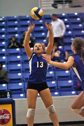 Bryant senior Taylor West (13) sets for teammate Alyssa Anderson. (Photo by Rick Nation)