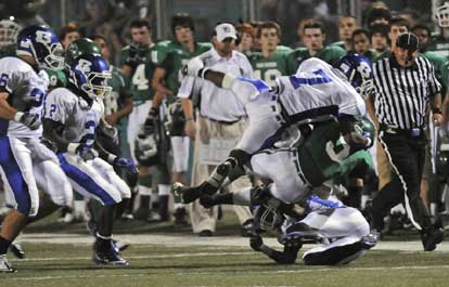 Aaron Bell helps make a flying tackle of Van Buren's Wacey Connor (5) as held arrives from Dillon Winfrey (2) and Marshall Everett (26). (Photo by Ron Boyd)