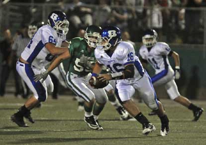 Hayden Lessenberry (16) rolls out to the left, picking up a block from tackle Seth Alkire (64). (Photo by Ron Boyd)