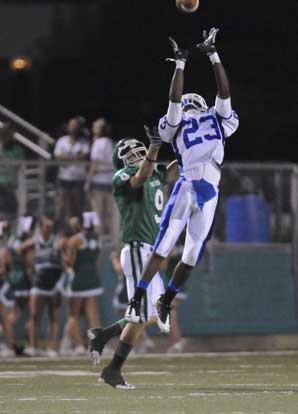 Travis Royal (23) goes high to try to pick off a pass in front of Van Buren's Gunner Miller. (Photo by Ron Boyd)