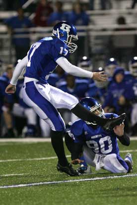 Jace Denker kicks the game-winning field goal out of the hold of Tyler Jamison. (Photo by Rick Nation)