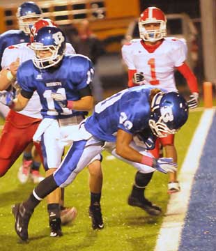 Jalen Bell scores in front of teammate Hayden Daniel (11) and Cabot's Chris Luna (1). (Photo by Kevin Nagle)