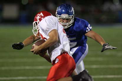 Michael Smith descends on Cabot running back Zach Launius. (Photo by Rick Nation)