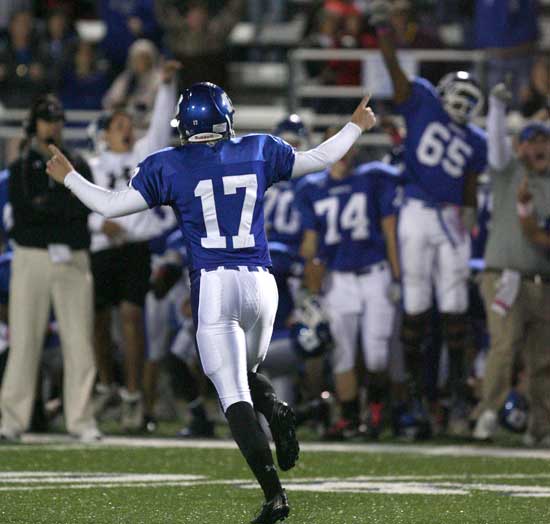 Jace Denker runs to the sideline to join his teammates in celebrating his game-winning field goal Friday night against Cabot. (Photo by Rick Nation)