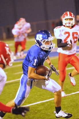 Sawyer Nichols turns upfield to add some yardage after a catch. (Photo by Kevin Nagle)