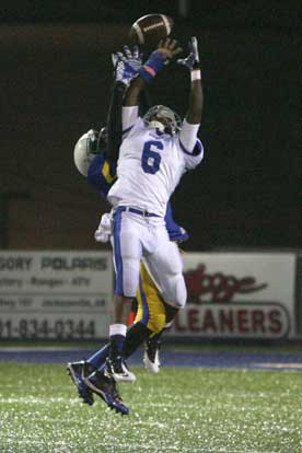 K.J. Hill (6) battles with a North Little Rock defender to pull down a pass. (Photo by Rick Nation)