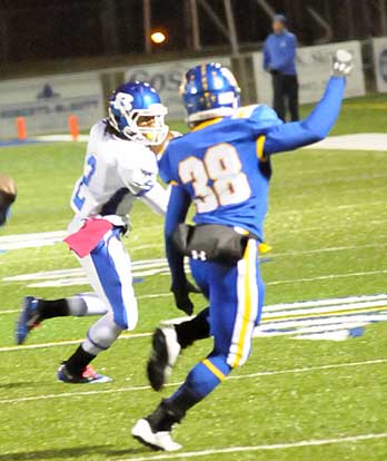 Dillon Winfrey (2) tries to get around North Little Rock's Martinez Butler (38). (Photo by Kevin Nagle)
