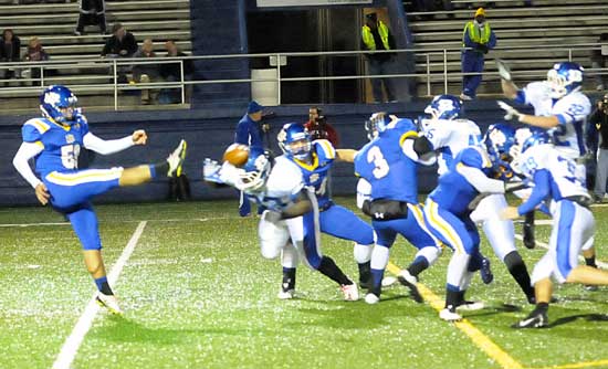 Did he or didn't he? Bryant's Tyree Reese reaches out to try to block a punt by North Little Rock's Hasheem Abdelrahman early in Friday night's game. It was ruled that Reese did not get a piece of the kick and the Hornets were cited for roughing the kicker. (Photo by Kevin Nagle)