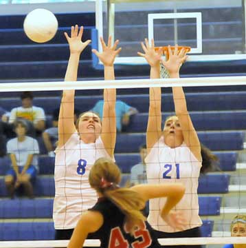 Erica Smith (8) and Courtney Davidson (21) go up for a block. (Photo by Kevin Nagle)