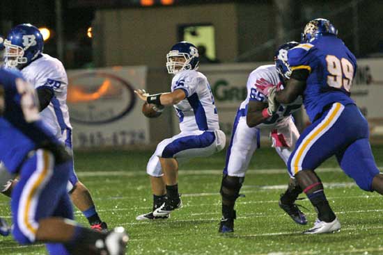 Hayden Lessenberry sets to throw as Jordan Jones, left, and Kordell Boykins (65) provide protection. (Photo by Rick Nation)