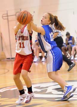 Kara Moser (12) deflects a pass. (Photo by Kevin Nagle)