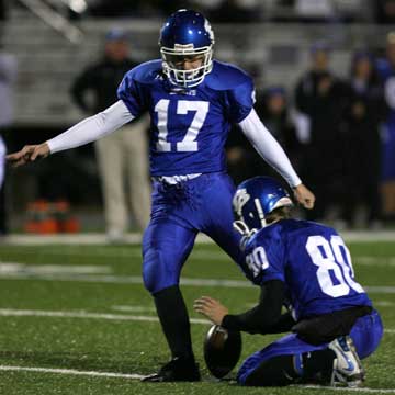 Jace Denker (17) kicks an extra point with Tyler Jamison holding. (Photo by Rick Nation)