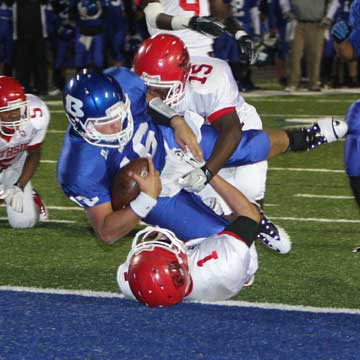 Hayden Lessenberry (16) dives into the end zone over Northside's Gray Stanton (1) and Josh Kinnard (15). (Photo by Rick Nation)