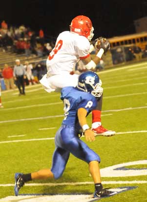 Bryant's Caleb Thomas (8) upends Northside's Shaquille Jones. (Photo by Kevin Nagle)