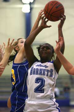 Jayla Anderson (2) tries to get a shot away. (Photo by Rick Nation)