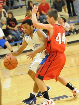 Bryant's Marcus Withers tries to drive around Vilonia's Lucas Nicholson. (Photo by Kevin Nagle)