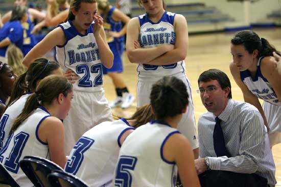 Bryant freshman coach Nathan Castaldi instructs his team during a timeout. (Photo by Rick Nation)