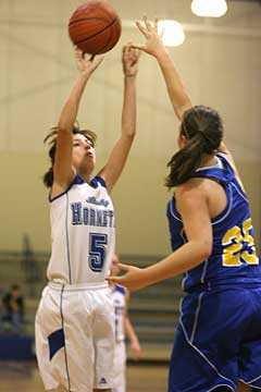 Destiny Huffman (5) shoots over Lakeside's Caroline Cole. (Photo by Rick Nation)