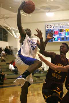 J.C. Newborn goes up for a shot over Lake Hamilton's Jason Burks. (Photo by Rick Nation)