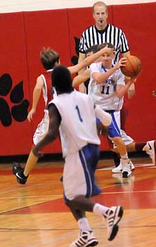 Bryant's Dylan Hurt (11) tries to clear the ball to teammate Simeon Watson (1). (Photo by Kevin Nagle)