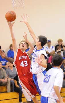 Jake Scoggins (45) goes for a block. (Photo by Kevin Nagle)