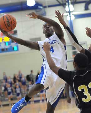 K.J. Hill (4) tries to finish off a drive. (Photo by Kevin Nagle)