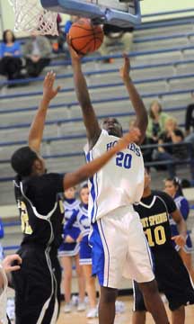 J.C. Newborn (20) goes up for a point-blank shot. (Photo by Kevin Nagle)