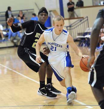 Bryant's John Winn (21) works his way through the Hot Springs defense. (Photo by Kevin Nagle)