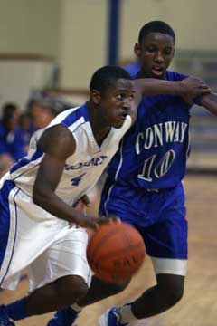 K.J. Hill, left, works the up the floor against pressure. (Photo by Rick Nation)