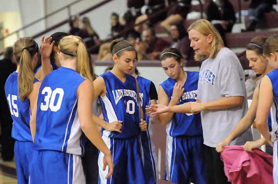 Bryant White coach DeAnna Ward instructs her team during a timeout. (Photo by Kevin Nagle)