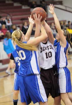 Julie Ward (30) and Shayla McKissock trap Benton's Morgan Neathery. (Photo by Kevin Nagle)