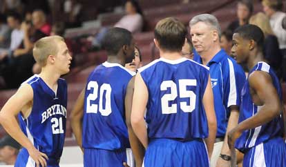 Bryant coach Jim Pennington meets with his team during a break in the action Monday. (Photo by Kevin Nagle)