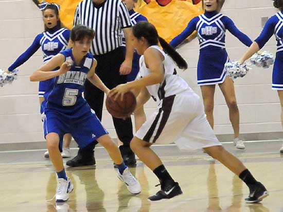 Bryant's Destiny Huffman (5) defends against Benton's Haley Reynolds. (Photo by Kevin Nagle)