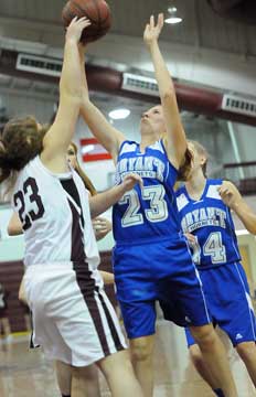Bryant's Kiarra Sollinger (23) goes up for a shot in front of teammate Brittney Earls (14). (Photo by Kevin Nagle)