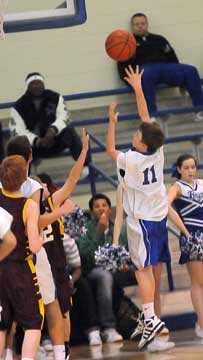 Dylan Hurt (11) sends up a shot. (Photo by Kevin Nagle)