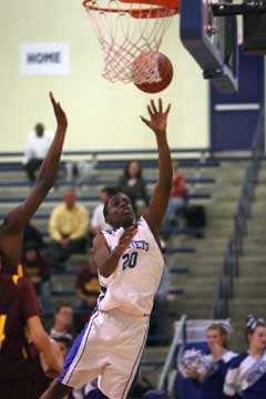 J.C. Newborn scores for Bryant inside. (Photo by Rick Nation)