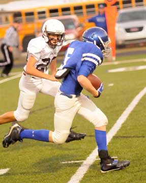 Bryant's Liam Miller (5) heads to the end zone with Benton's Colton Nix (20) in pursuit. (Photo by Kevin Nagle)