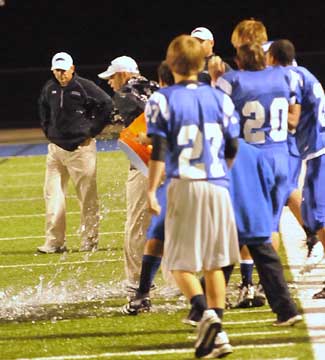 Head coach Kenny Horn gets a victory dowsing. (Photo by Kevin Nagle)