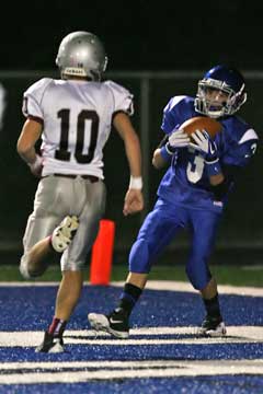 Bryant's Mitchell Reev3s (3) catches a touchdown pass in front of Benton's Nick Quinn. (Photo by Rick Nation)