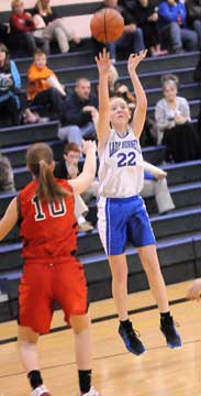 Brittney Sahlmann launches a jumper. (Photo by Kevin Nagle)